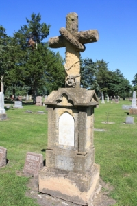 This monument features an anchor at the base of the cross.